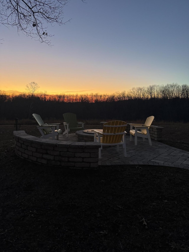 1770 Logan Ridge Rd, Ozark, MO 65721 - patio terrace at dusk with a fire pit