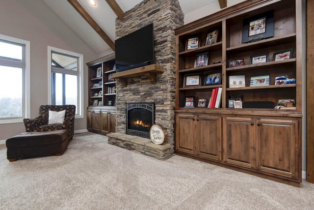 1770 Logan Ridge Rd, Ozark, MO 65721 - living area featuring baseboards, vaulted ceiling with beams, carpet, and a fireplace
