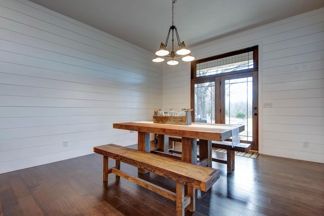 1770 Logan Ridge Rd, Ozark, MO 65721 - dining area featuring wood walls, a chandelier, and dark wood-type flooring