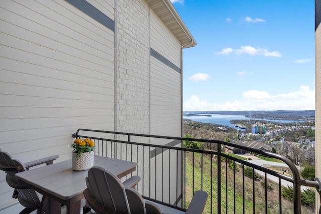 balcony featuring a water view