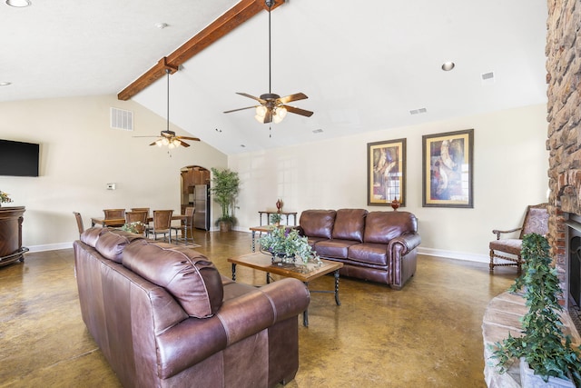 living room featuring a ceiling fan, finished concrete floors, visible vents, arched walkways, and baseboards