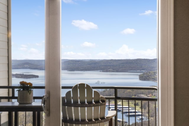 balcony featuring a water view
