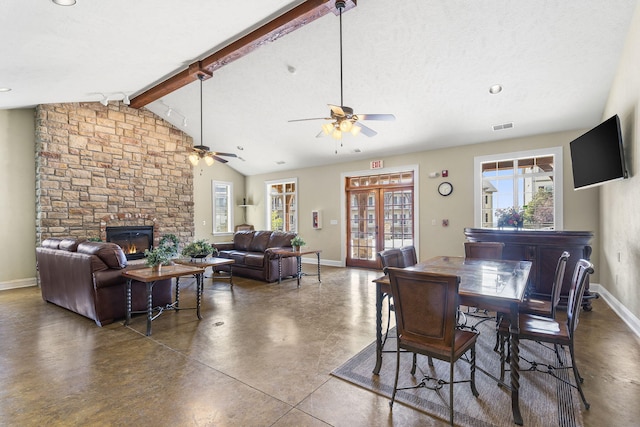 dining space with concrete flooring, ceiling fan, visible vents, and vaulted ceiling with beams