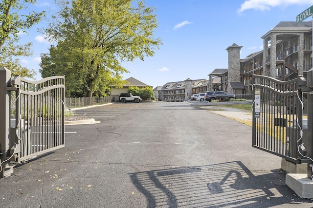 view of road with a gate and a residential view