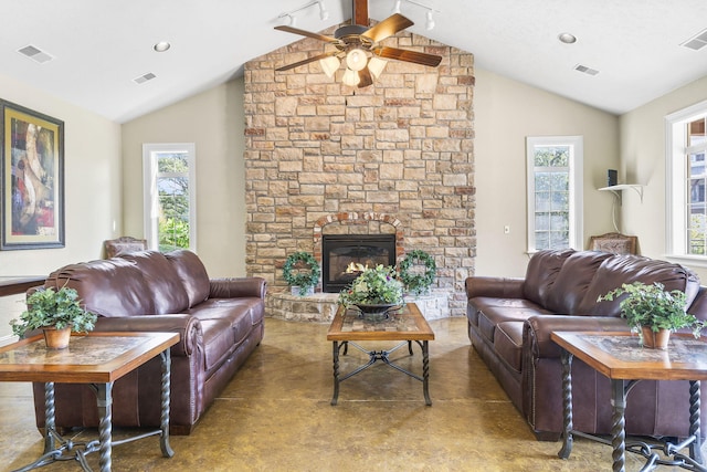 living area with a ceiling fan, vaulted ceiling, and visible vents