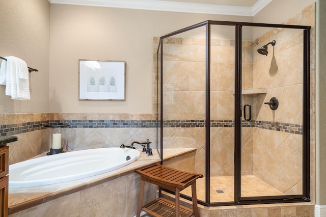bathroom with a bath, a stall shower, and ornamental molding