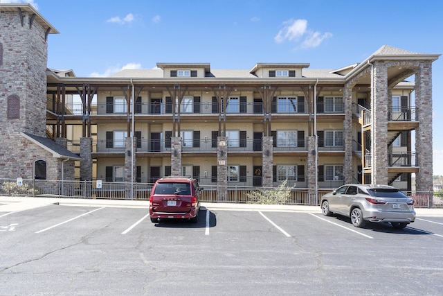 view of property featuring uncovered parking