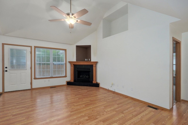 unfurnished living room featuring ceiling fan, light wood-style floors, high vaulted ceiling, baseboards, and visible vents