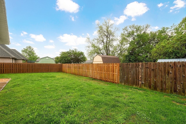 view of yard with a fenced backyard