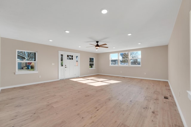 unfurnished living room with baseboards, a ceiling fan, recessed lighting, and light wood-type flooring