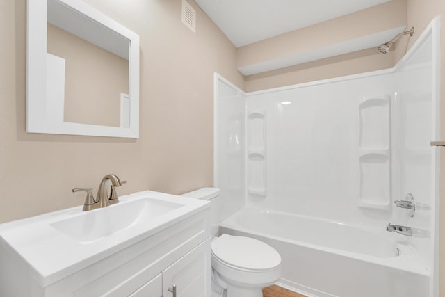 full bathroom with washtub / shower combination, vanity, toilet, and visible vents