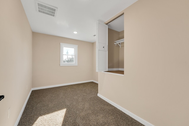 carpeted empty room with recessed lighting, baseboards, and visible vents