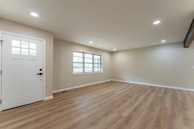 entrance foyer featuring recessed lighting, light wood-style floors, and a healthy amount of sunlight