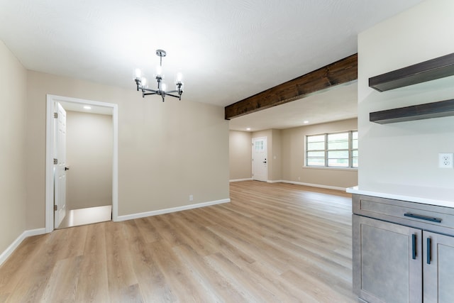 unfurnished dining area with recessed lighting, baseboards, a chandelier, and light wood finished floors
