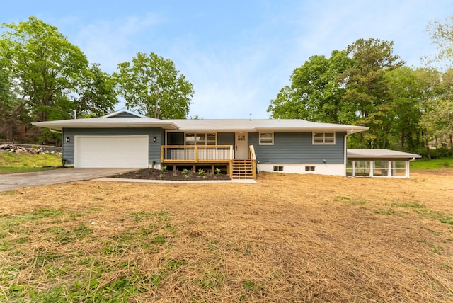single story home with an attached garage and driveway
