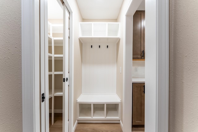 mudroom with light wood-style floors