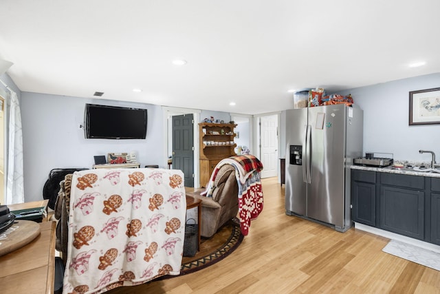 dining area featuring light wood-style floors and recessed lighting