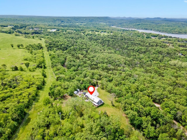 birds eye view of property with a wooded view