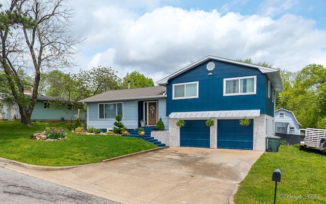 split level home featuring an attached garage, brick siding, driveway, and a front lawn