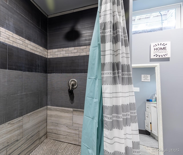 bathroom with tiled shower
