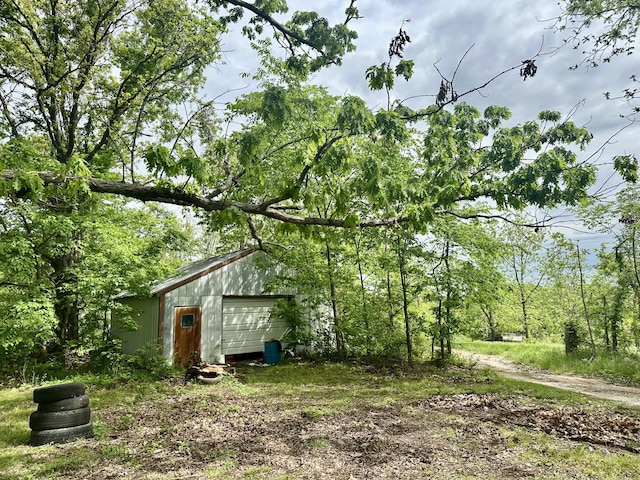 exterior space featuring a detached garage