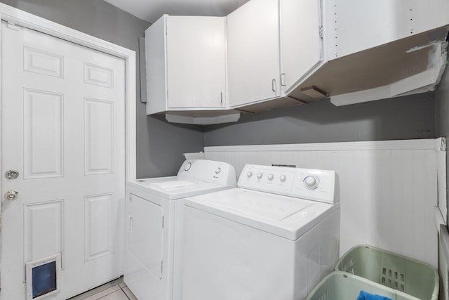 laundry area with cabinet space and washing machine and clothes dryer