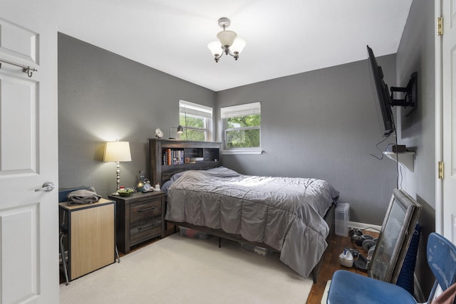 bedroom with a chandelier