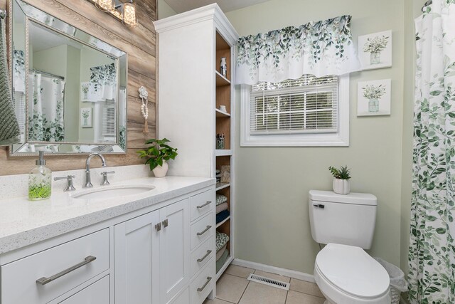 1730 N Pine St, Marshfield, MO 65706 - full bath with visible vents, vanity, toilet, baseboards, and tile patterned floors