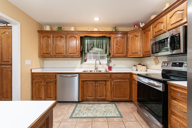 1730 N Pine St, Marshfield, MO 65706 - kitchen featuring brown cabinets, stainless steel appliances, and a sink