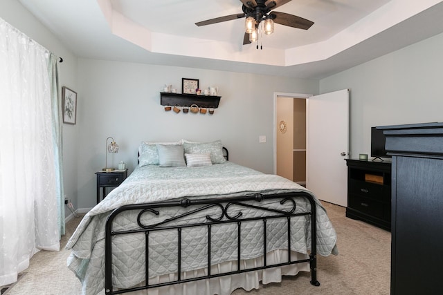 1730 N Pine St, Marshfield, MO 65706 - bedroom featuring light colored carpet, a raised ceiling, and ceiling fan