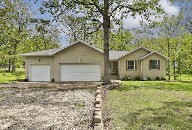 1730 N Pine St, Marshfield, MO 65706 - ranch-style house featuring brick siding, a front lawn, an attached garage, and driveway
