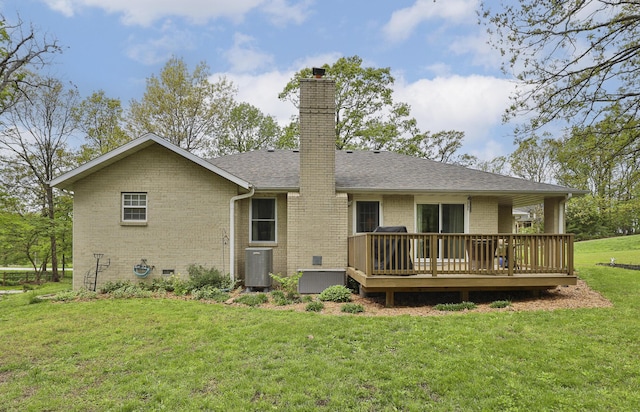 1730 N Pine St, Marshfield, MO 65706 - back of house featuring brick siding, a deck, a chimney, cooling unit, and a lawn