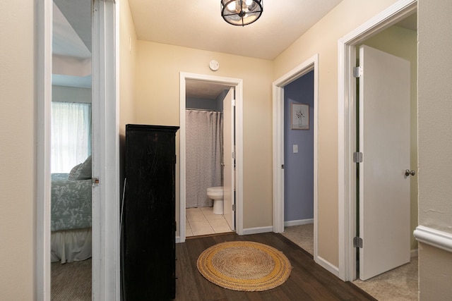 1730 N Pine St, Marshfield, MO 65706 - hallway featuring baseboards and wood finished floors