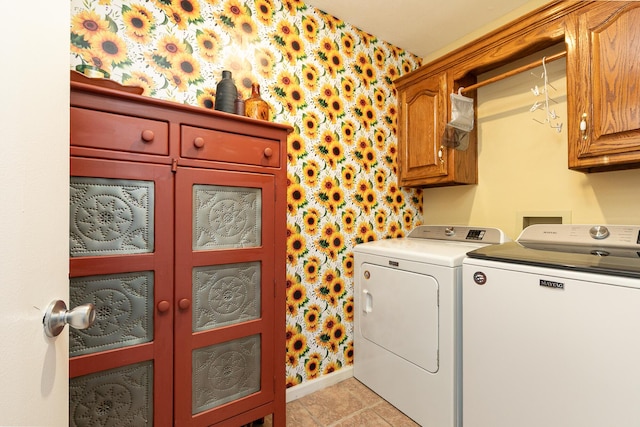 1730 N Pine St, Marshfield, MO 65706 - washroom featuring washing machine and dryer, cabinet space, light tile patterned floors, baseboards, and wallpapered walls