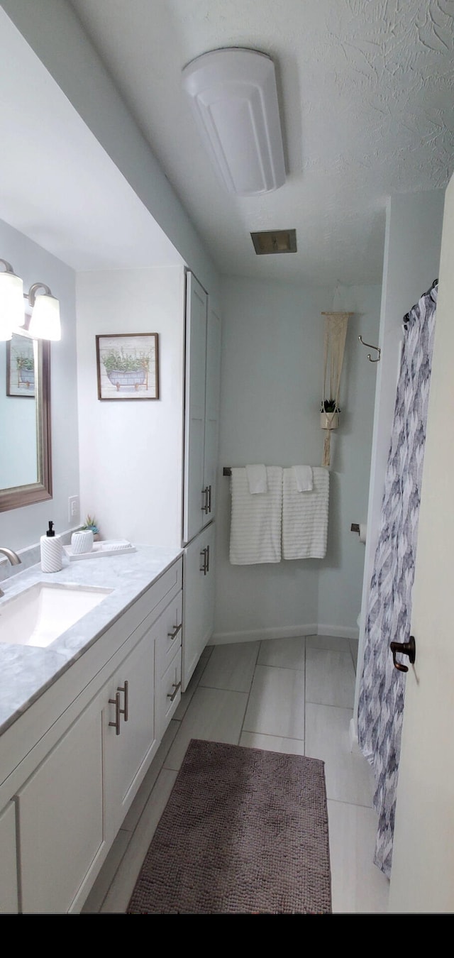 bathroom featuring vanity and a shower with curtain