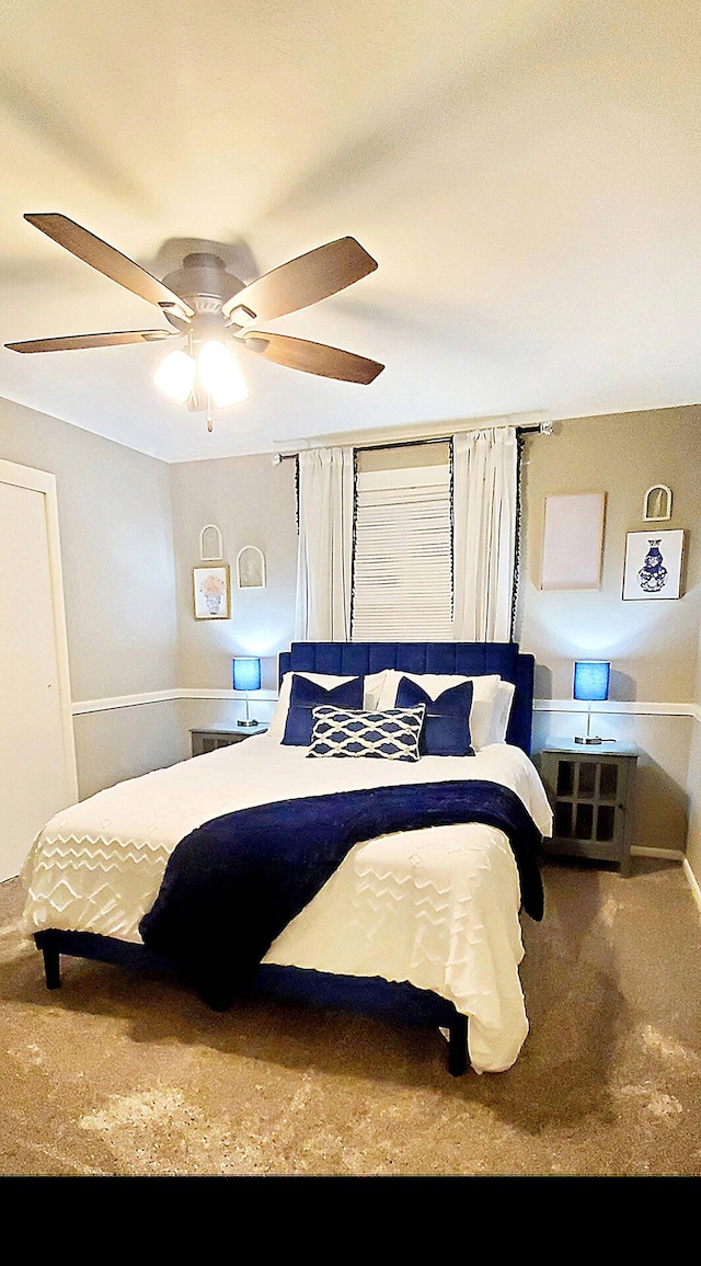 carpeted bedroom featuring a ceiling fan