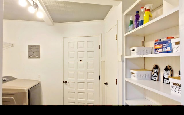 clothes washing area with laundry area and washer / clothes dryer