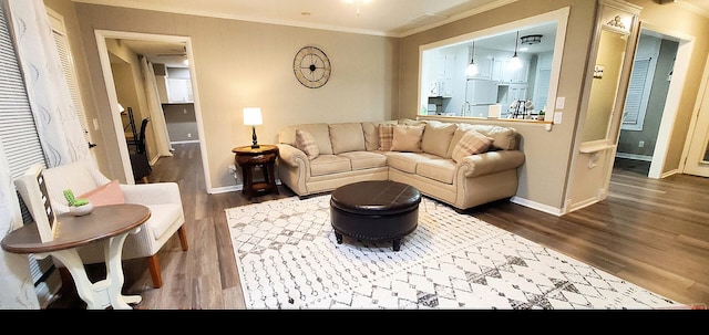 living room with baseboards, dark wood-style floors, and ornamental molding