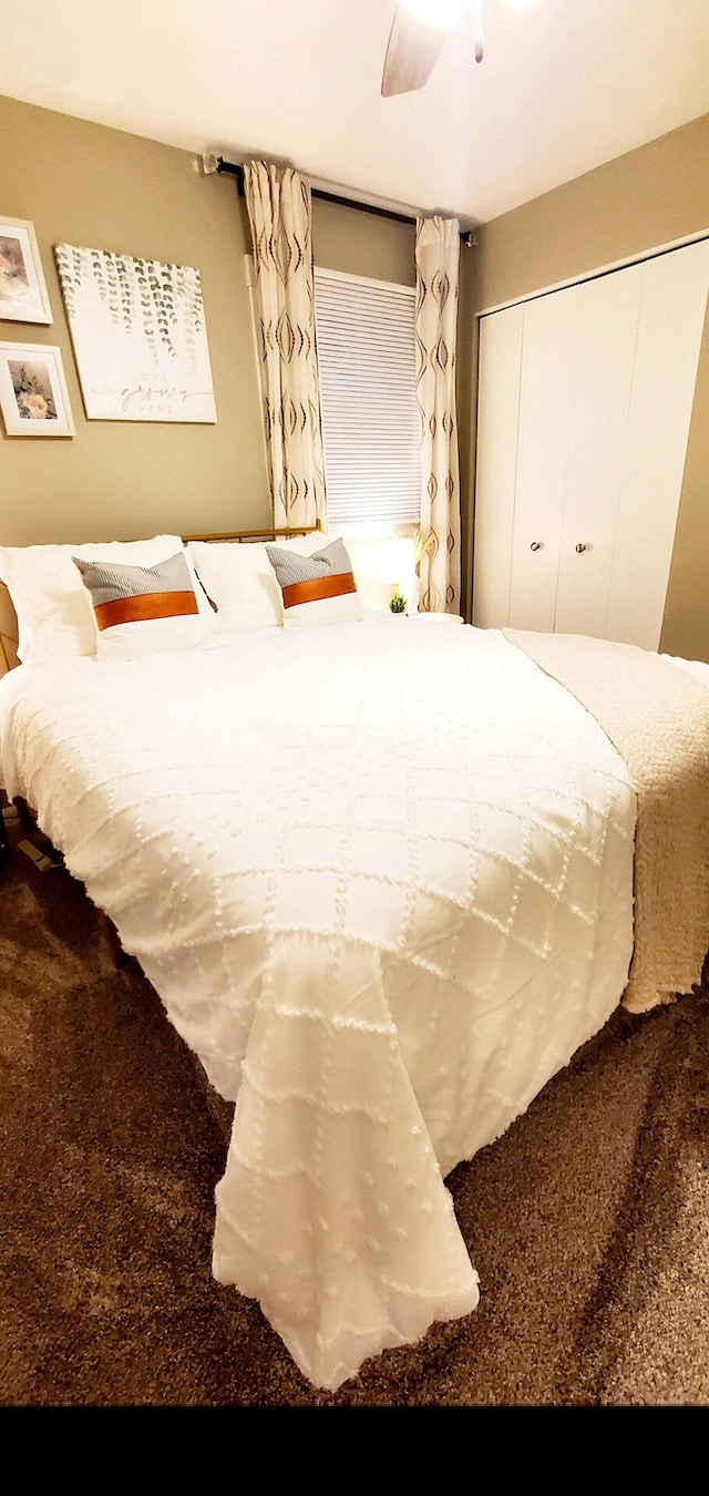 bedroom featuring carpet flooring, ceiling fan, and a closet