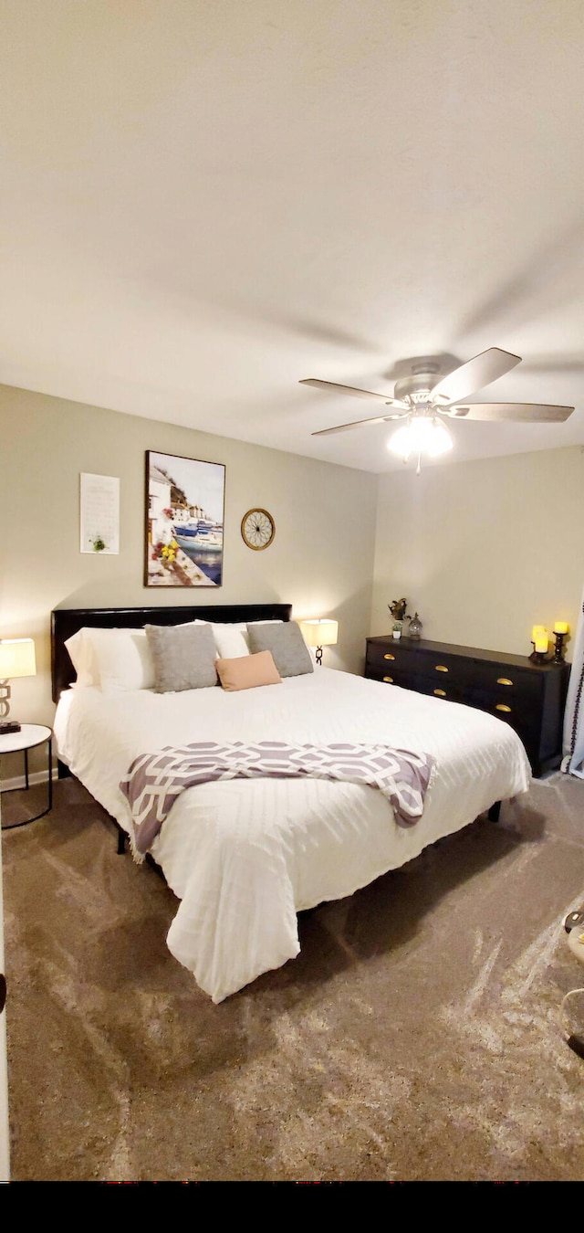 carpeted bedroom featuring a ceiling fan