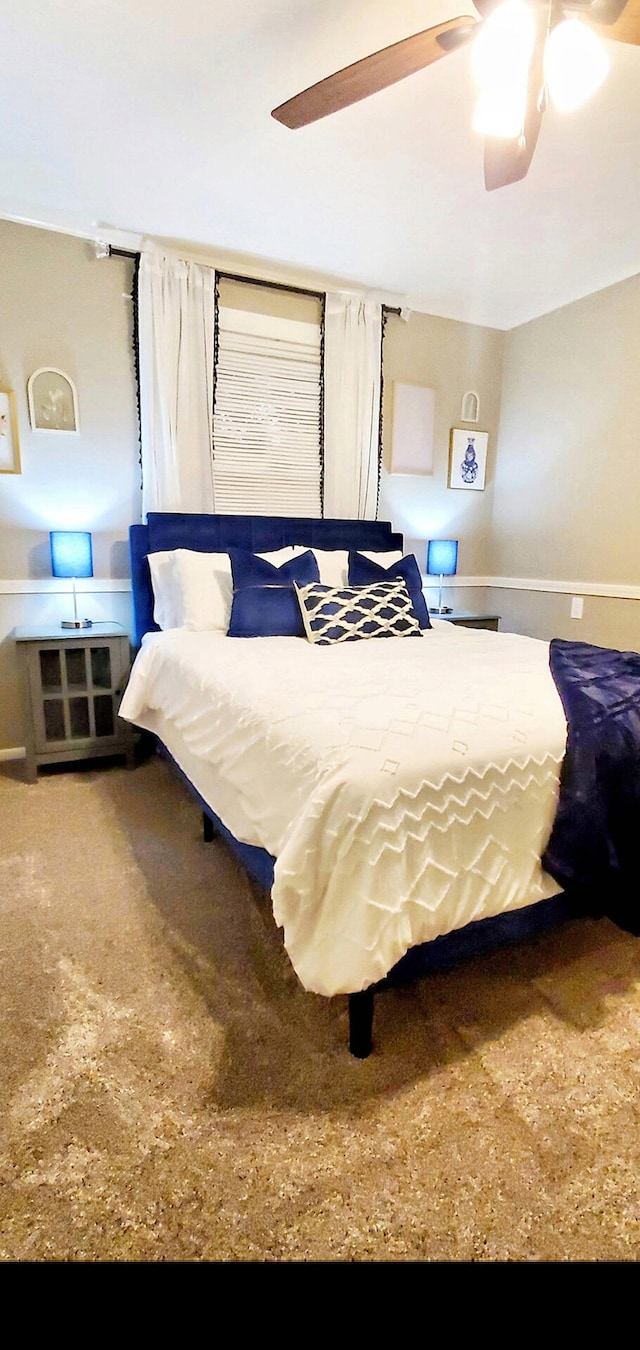 carpeted bedroom with a ceiling fan