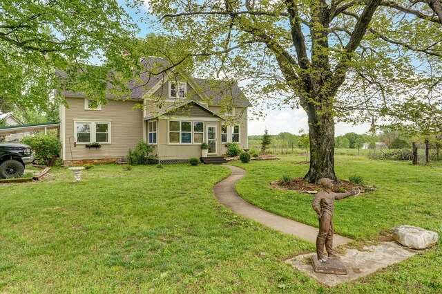 1487 E Lelia Ln, Springfield, MO 65803 - view of front of home with entry steps and a front yard