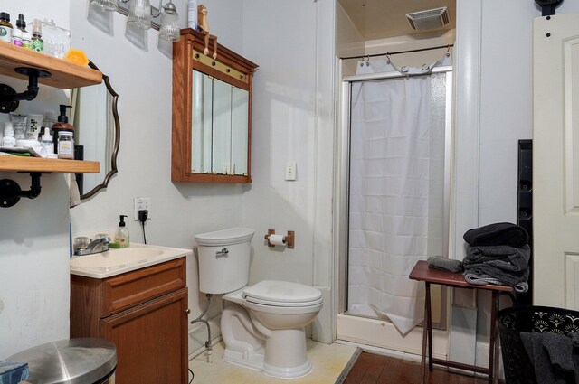 1487 E Lelia Ln, Springfield, MO 65803 - bathroom featuring vanity, a stall shower, toilet, and visible vents