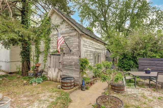 1487 E Lelia Ln, Springfield, MO 65803 - view of outbuilding featuring an outdoor structure and outdoor dining area