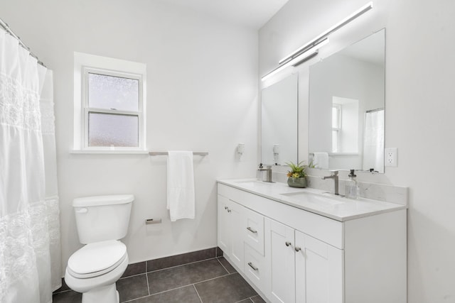635 W Bridgewood Ct, Springfield, MO 65803 - full bathroom featuring tile patterned floors, toilet, double vanity, and baseboards