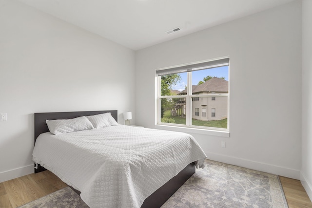 635 W Bridgewood Ct, Springfield, MO 65803 - bedroom with baseboards and wood finished floors