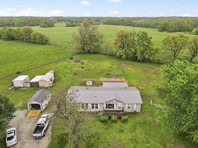 birds eye view of property with a rural view