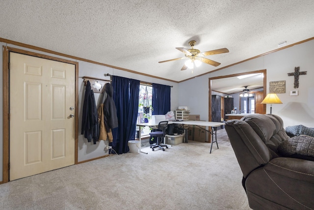 living room with a ceiling fan, a textured ceiling, vaulted ceiling, ornamental molding, and carpet