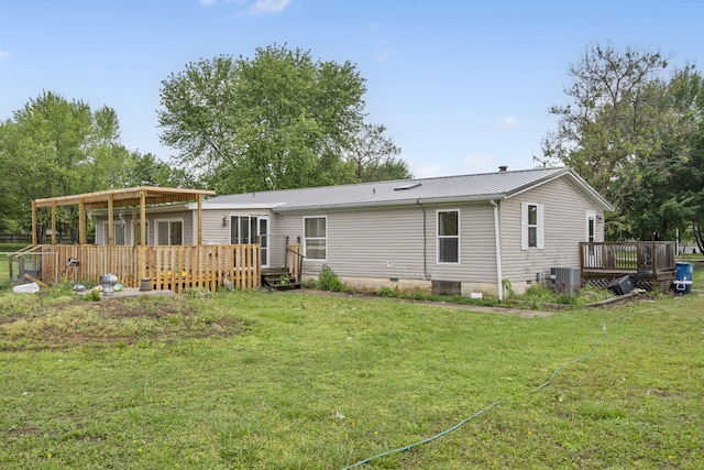 rear view of property with a wooden deck, cooling unit, crawl space, metal roof, and a lawn