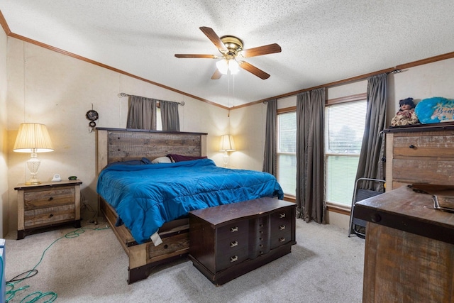 bedroom featuring crown molding, a ceiling fan, carpet flooring, and a textured ceiling